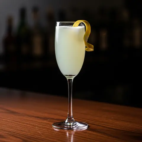 Death in the Afternoon cocktail made with champagne, served in a champagne flute