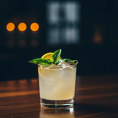 Gin Basil Smash cocktail made with gin, served in a rocks glass