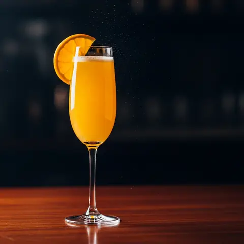 Mimosa cocktail made with champagne, served in a champagne flute