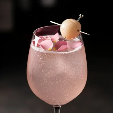 Rose Lychee Spritz cocktail made with none, served in a wine glass
