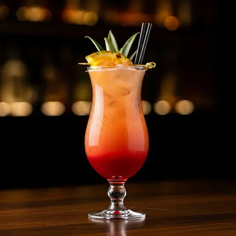 Tropical Sunset Mocktail cocktail made with none, served in a hurricane glass